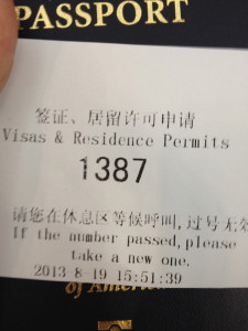 Taking a number at the Passport Office.  At the time, they were serving #1242.
